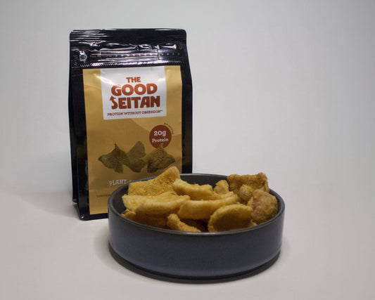 The Good Seitan plant-based cheeze chip flavor packaging with a bowl of chips to show texture