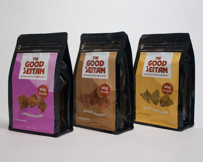 Three packages of 'The Good Seitan' protein chips on a white background