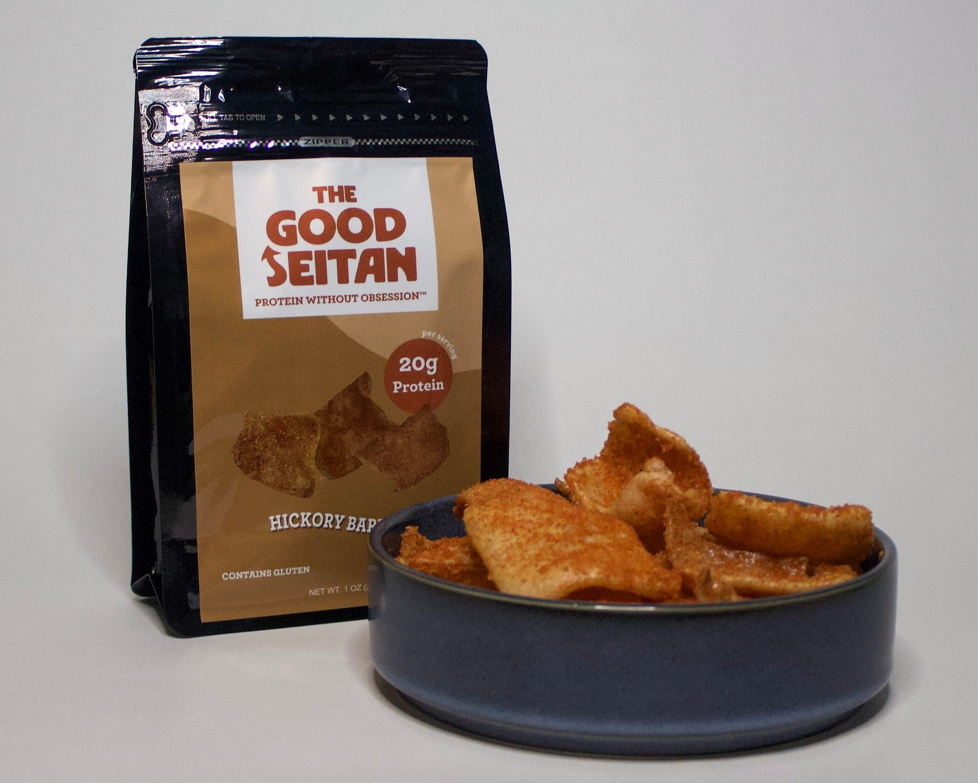 The Good Seitan hickory barbeque chips packaging with a bowl of chips to show texture