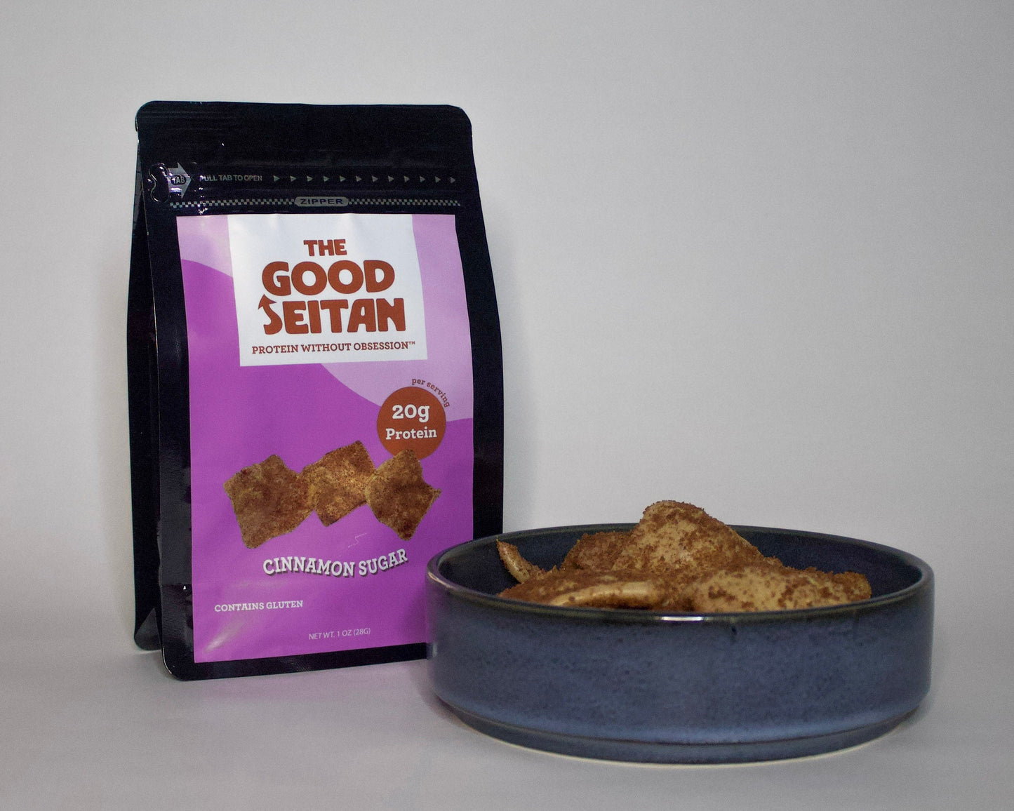 Bag of 'The Good Seitan' cinnamon sugar chips next to a bowl of chips to show texture